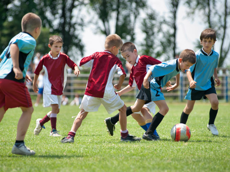 kids playing football outside